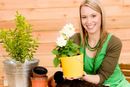 Sorted recycling bays with labelled containers for garden waste and recyclables